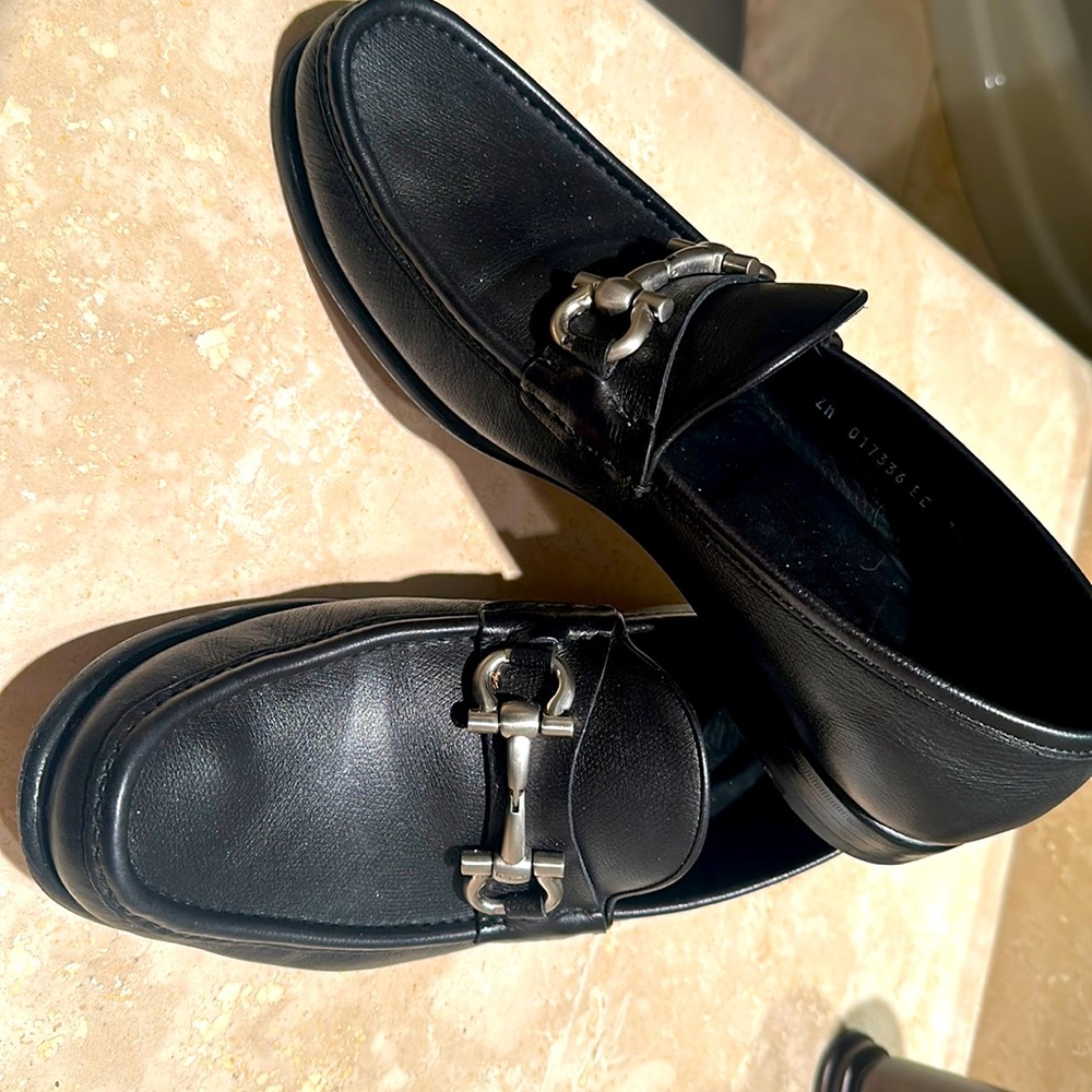 Men’s size 10 1/2 EE black, leather, Ferragamo shoes with silver buckles.